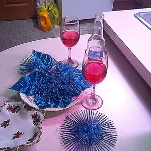Two wine glasses, plate, Christmas candy dish and decor.